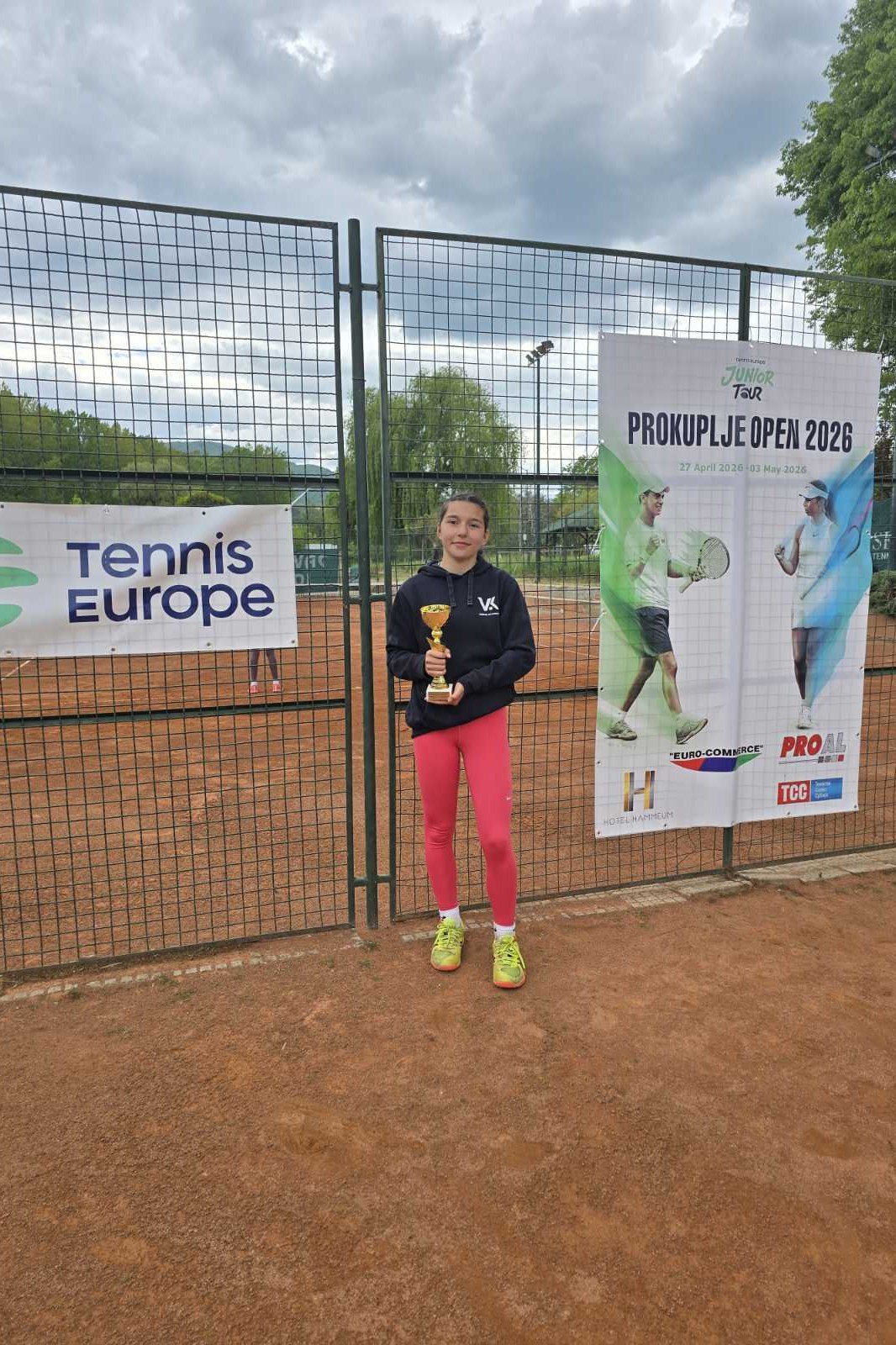 Ema with her trophy at a Tennis Europe tournament
